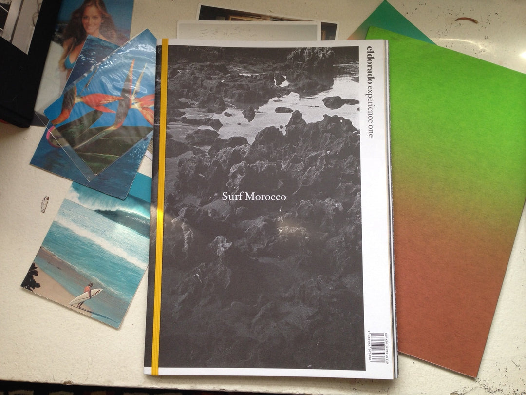 Surf Morocco book with surf pictures behind it