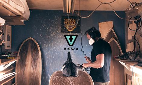 Man shaping a surfboard
