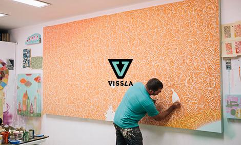 Man finishing up an art project with cool designs